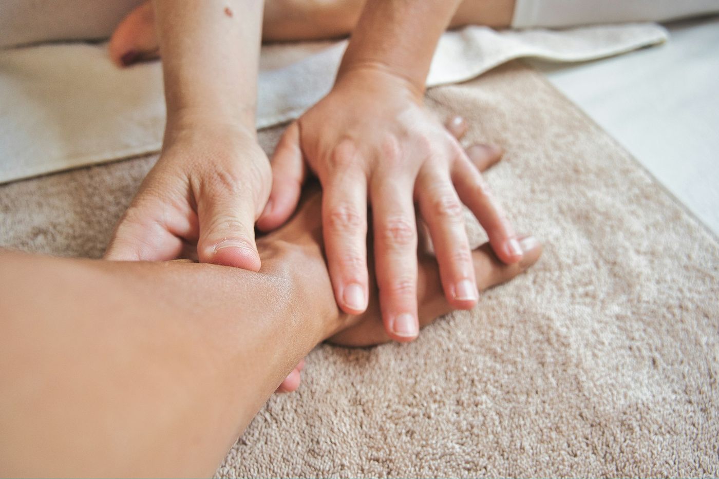 Massage therapist working on a client's shoulders